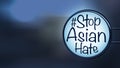 English texts Ã¢â¬Å#Stop Asian HateÃ¢â¬Â on label in front of shop at night, concept for calling international community to stop